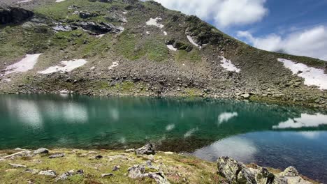 beautiful turquoise oberer plenderlessee with nice reflections and great mountains in the background, very close to kühtai in tyrol, austria