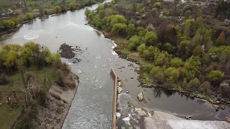 view of the two banks of the river and sewage treatment plant from a height in the summer.