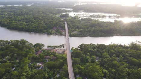 aerial view of bridge connecting riverbank villages from two district in bangladesh