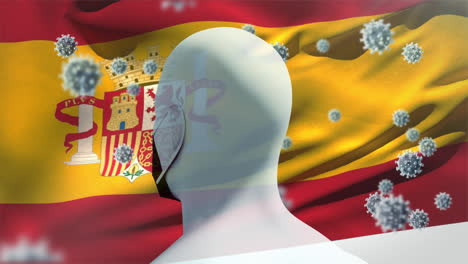 spanish flag waving against covid-19 cells and human head model wearing face mask