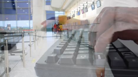 Air-hostess-with-suitcase-at-airport-against-person-typing-on-keyboard