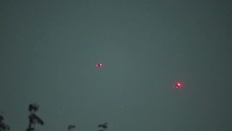 two police drones at night searching