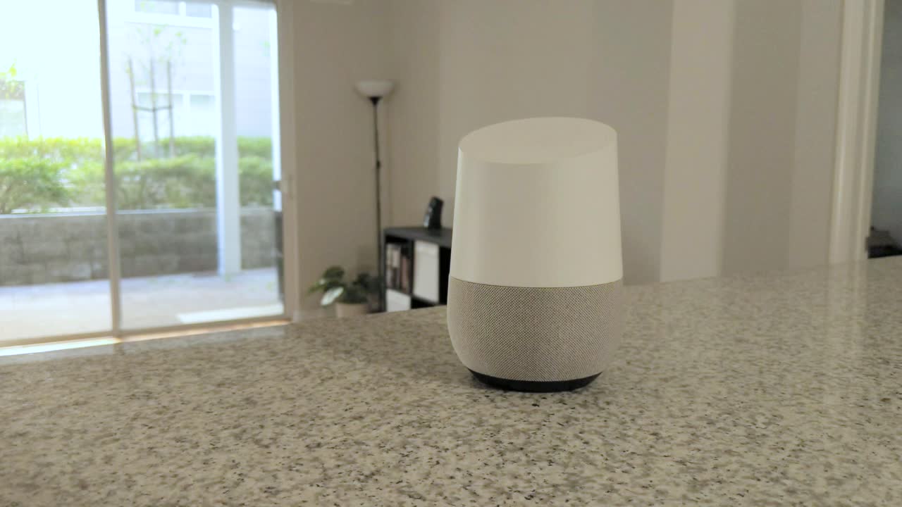 Voice controlled speaker turns off a light in a smart home