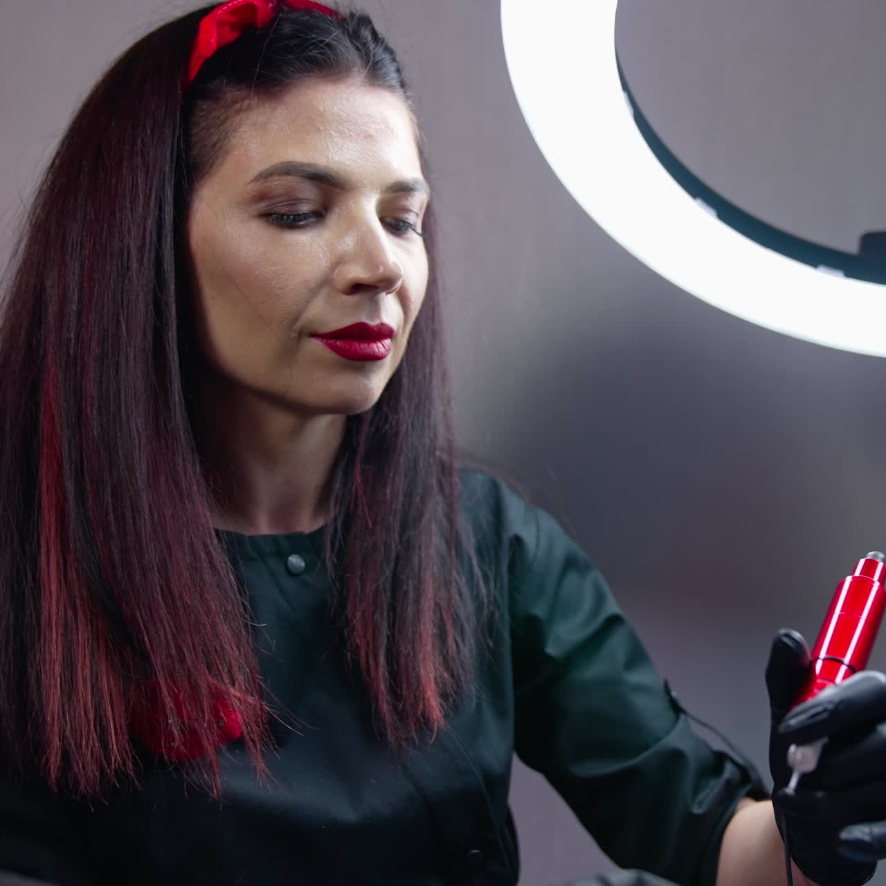 The cosmetologist checks his work. The cosmetologist checks if everything is fine with the patient after work