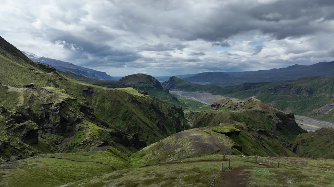 Fimmvörðuháls trail in slow motion, flying above the hiker, Iceland