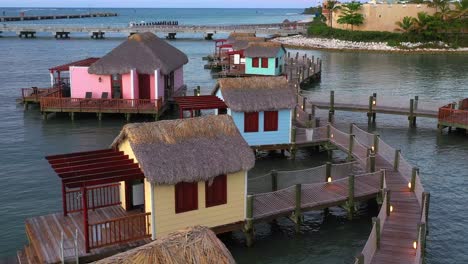 drone flight over water villas in amber cove, dominican republic. aerial