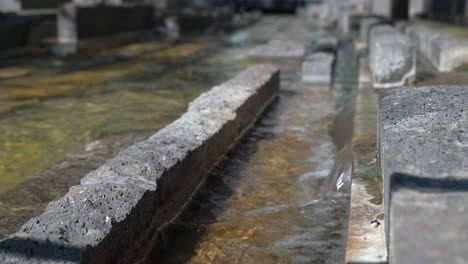 unique water feature with rows of rectangular rock - mall water feature