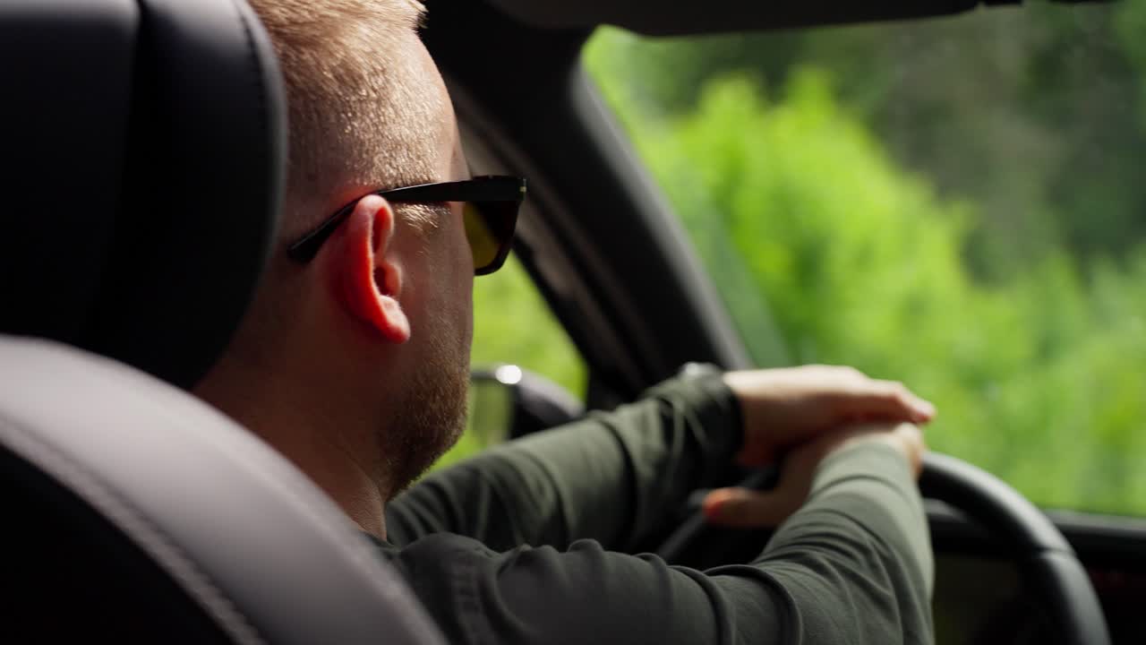 Man Driving Through the Forest
