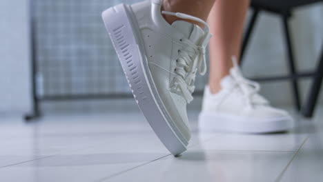 close-up of white platform sneakers