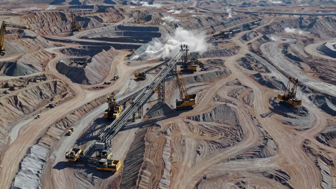 Aerial View of an Open Pit Mine with Heavy Machinery