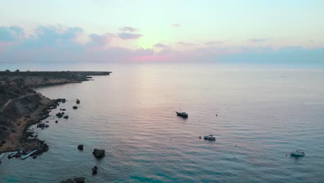 beautiful aerial shot over the water at konnos bay at sunset