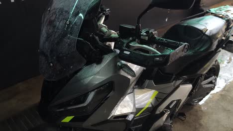 washing a grey motorcycle