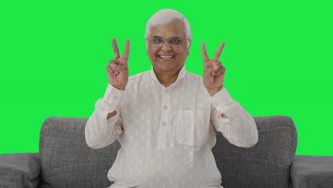 Happy-Indian-old-man-showing-victory-sign-Green-screen