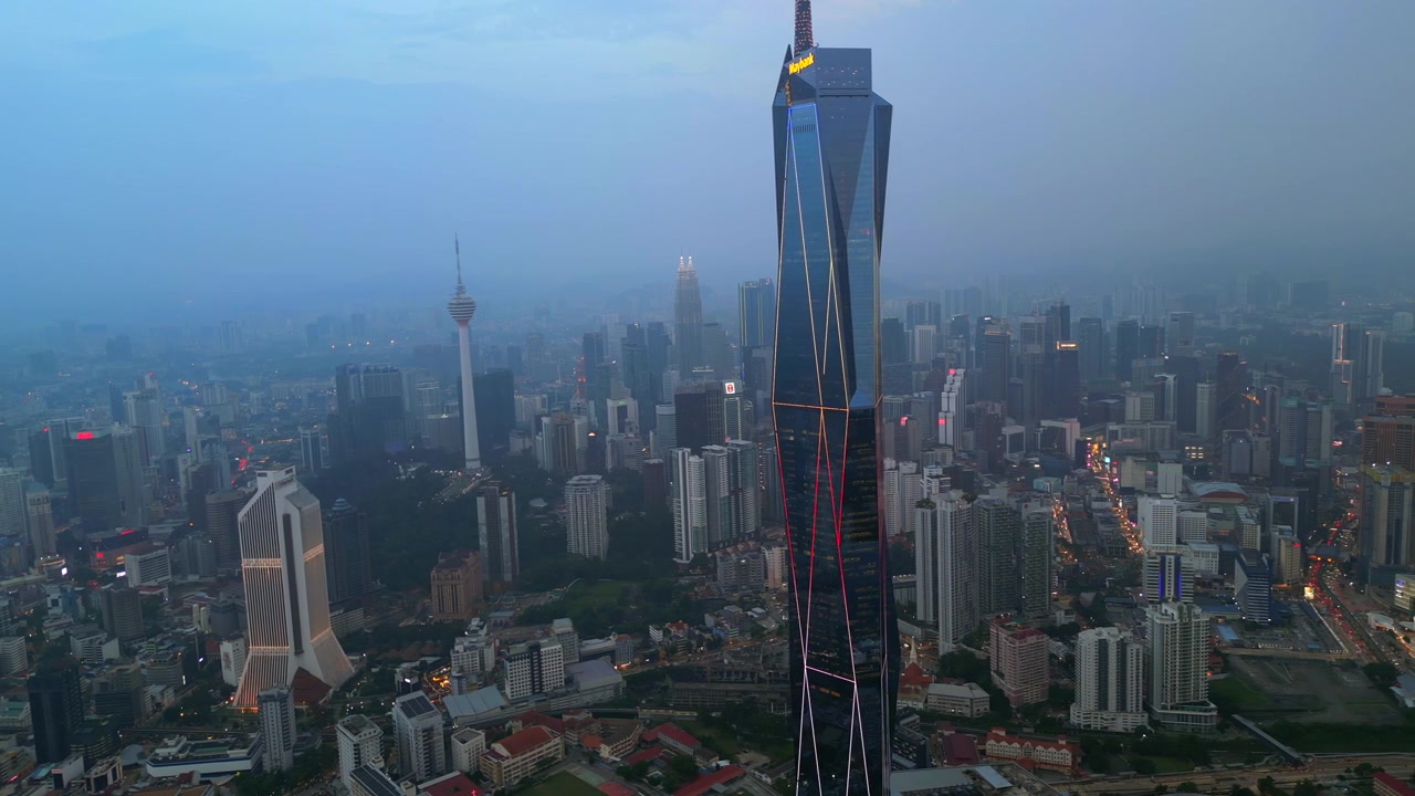 Kuala Lumpur City Hazy Air Pollution At Sunset Merdeka Skyscraper Drone Track Right 4K 30FPS