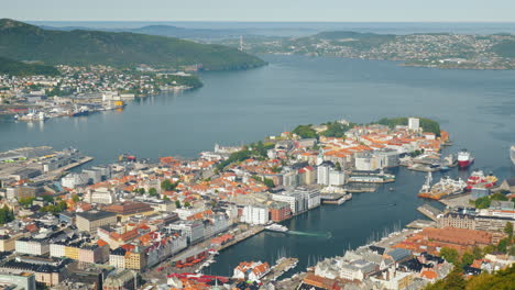 a view of the city of bergen below are the marinas and large cruise ships 4k video