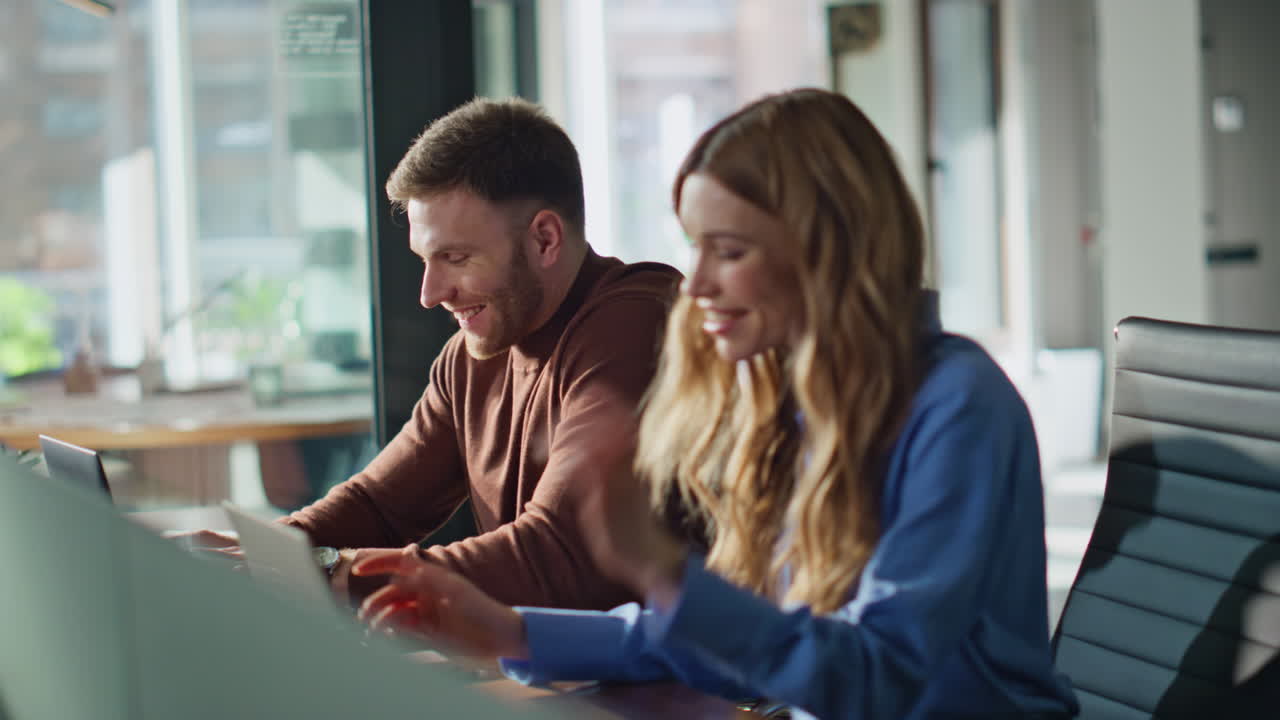 Office coworkers typing workspace talking each other closeup. Woman laughing