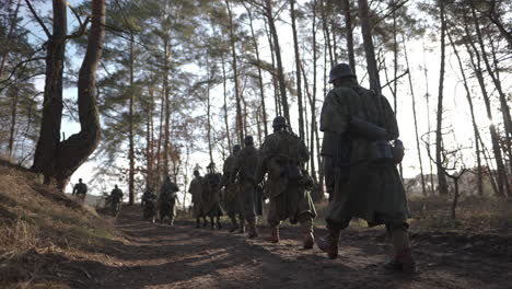 german soldiers marching through forest