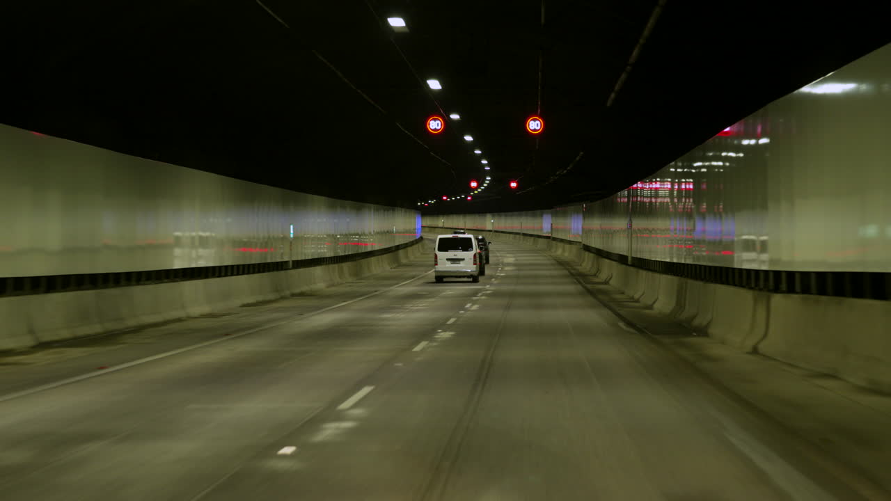 POV car Driving through a long tunnel, Sydney Australia