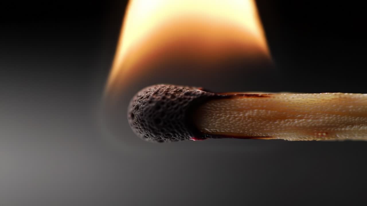 A Close-Up Journey of a Matchstick Igniting: The Transformation from Dormancy to a Vibrant Flame Captured in Two Stunning Frames