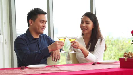 happy romantic couple eating lunch at restaurant