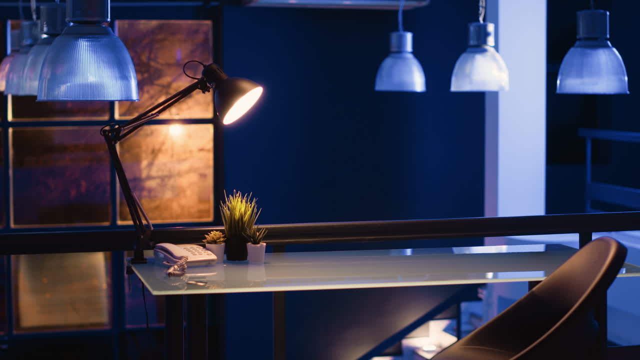 Woman working on laptop at desk in office