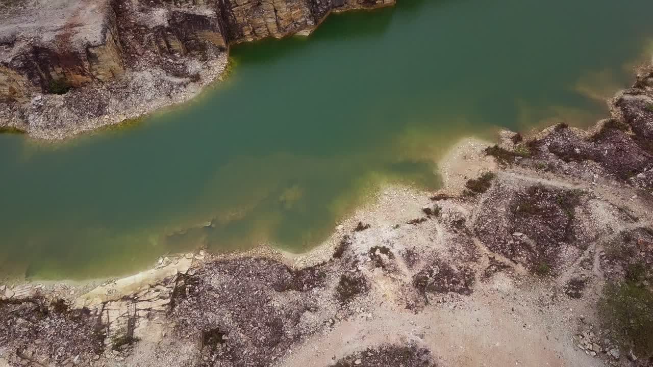 Clear turquoise water in a rocky quarry in Capitolio, Minas Gerais, Brazil
