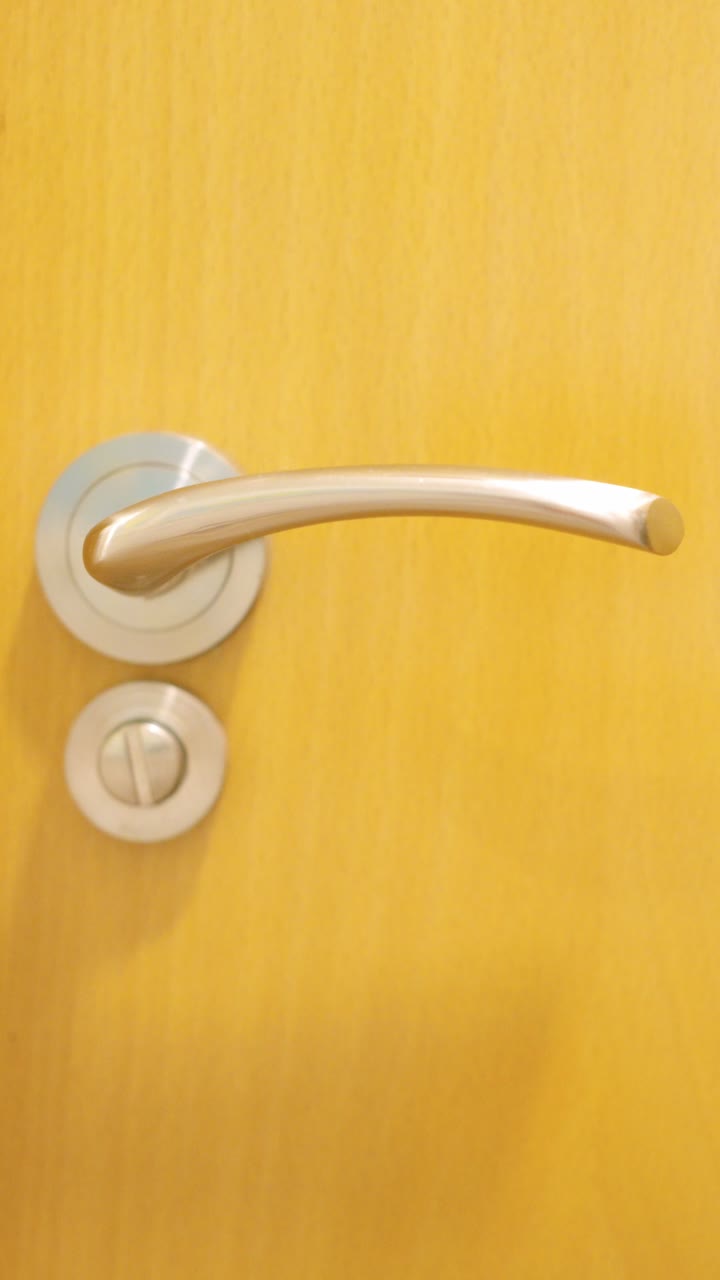 Man opening and closing bathroom door