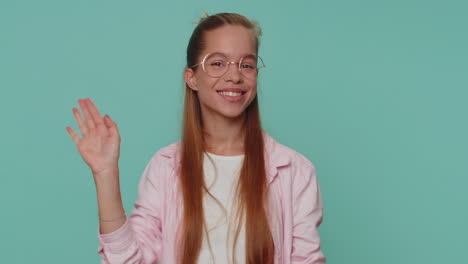 lovely girl appear from below waving hello with her palm, greeting with hospitable friendly smile