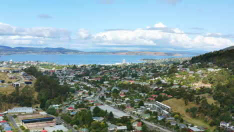 Aerial-Drone-Flyover-Hobart-City-Skyline-With-Derwent-River-View-In-Background,-4K-Australia-Slow-Motion