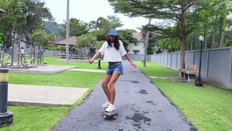 woman skateboarding in a park