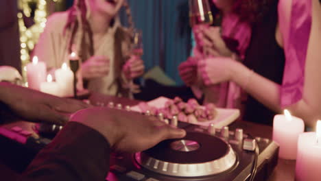 Man-playing-music-on-dj-table