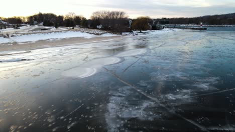 Ice-formations-on-Muskegon-lake,-Aerial-movement