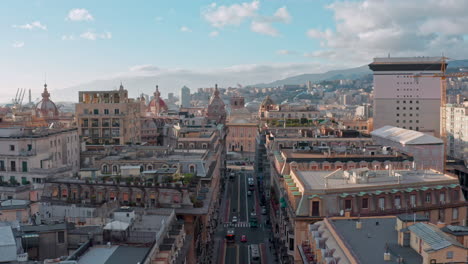 Genoa-skyline-aerial-approach-shot-toward-Piazza-De-Ferrari,-Liguria,-Italy