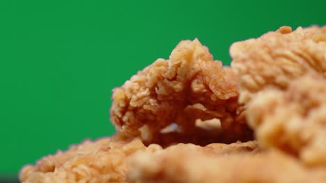 a pile of chicken strips rotates slowly.