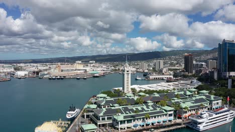 wide panning aerial shot of the aloha tower in the port of honolulu on the island of o'ahu, hawaii