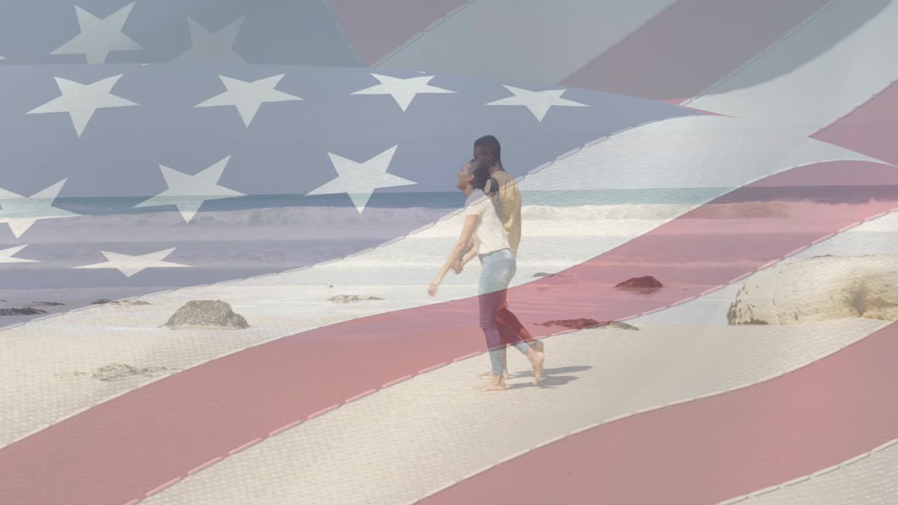 해변에서 손을 잡고 걸어가는 커플 위에 움직이는 미국  ⁇ 발의 애니메이션