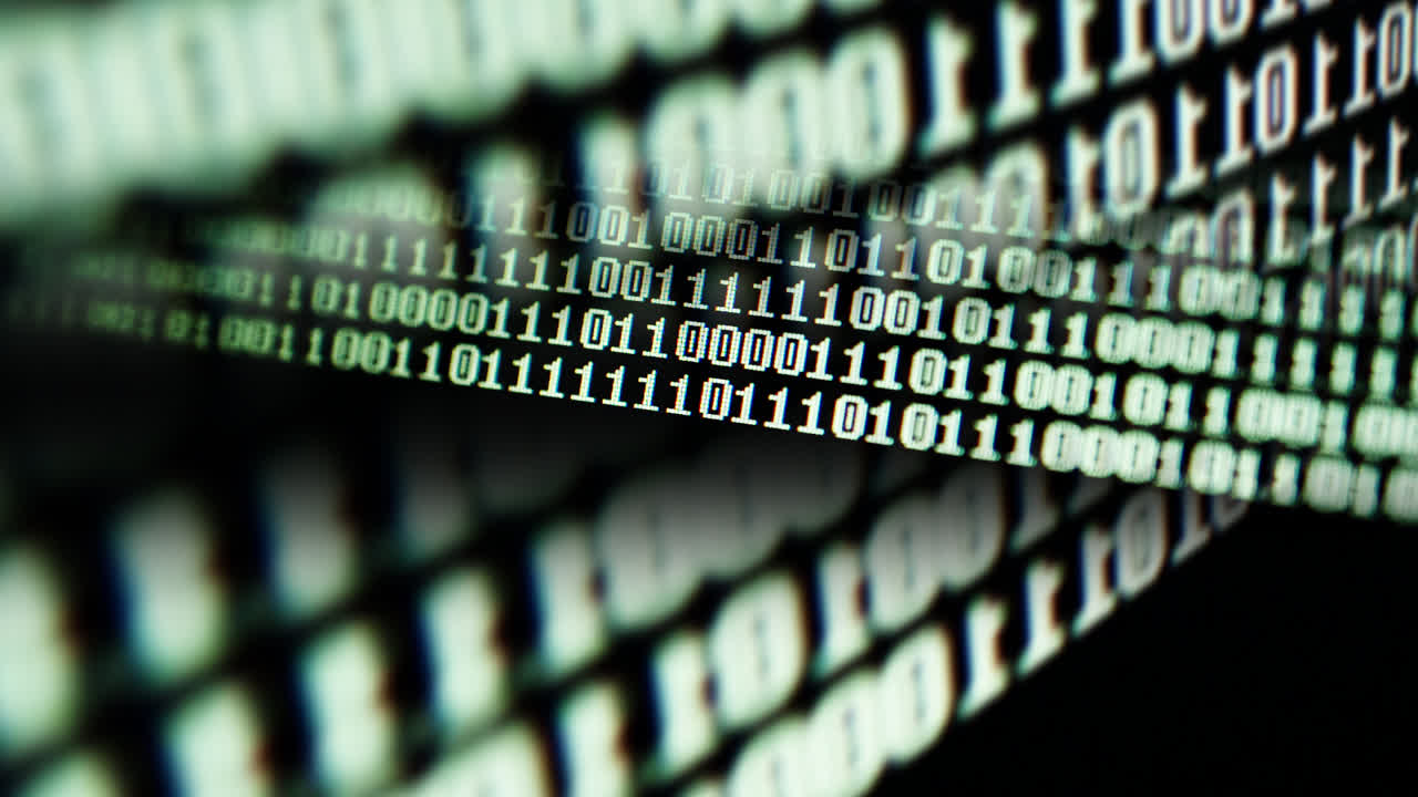 Binary code on the monitor screen. Shooting of a binary code, background