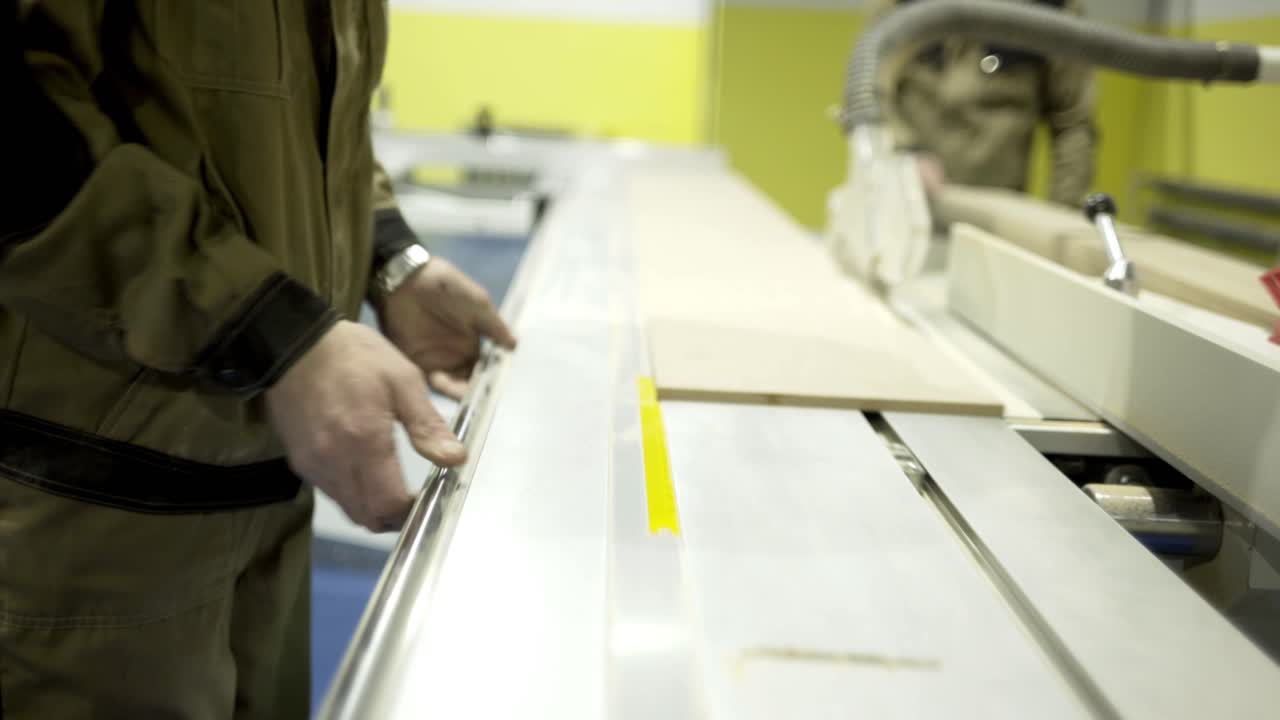 Woodworker operating a table saw
