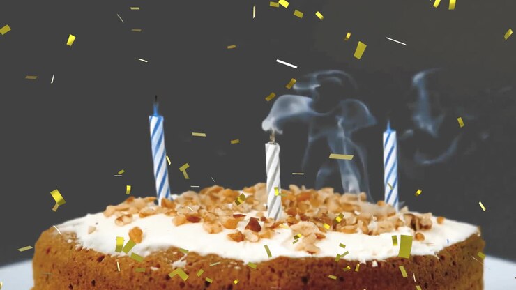 animation de confetti tombant et bougies éteintes sur le gâteau d'anniversaire