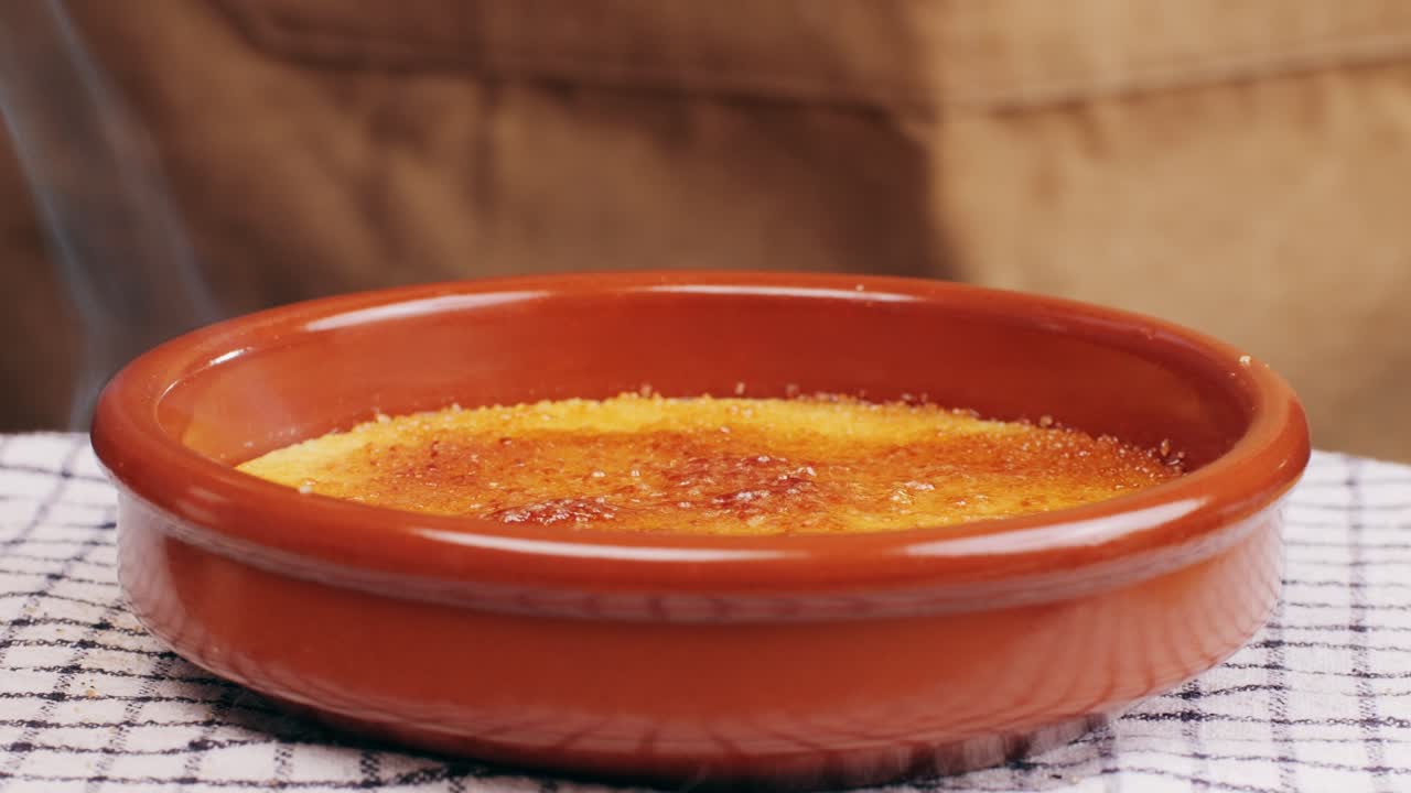 Spanish traditional food, catalonian dessert, crema catalana, catalan cream, spanish dessert close up, cooking.