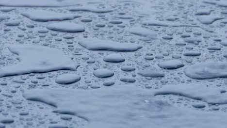 rain falls on a tabletop and forms beautiful shapes