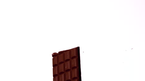 Arrow-shooting-through-a-chocolate-bar