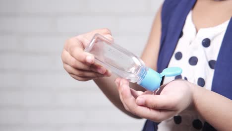 Child using hand sanitizer