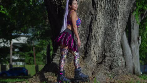 young girl wears roller blades mini skirt and leggings at the park on a sunny day