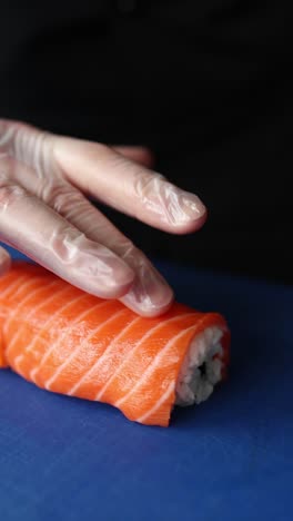 chef preparing salmon sushi