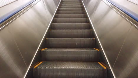 view while on the escalator moving to the platform in train station