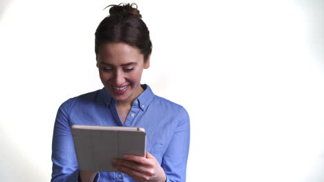 Shot-Of-Woman-Using-Digital-Tablet-Against-White-Background