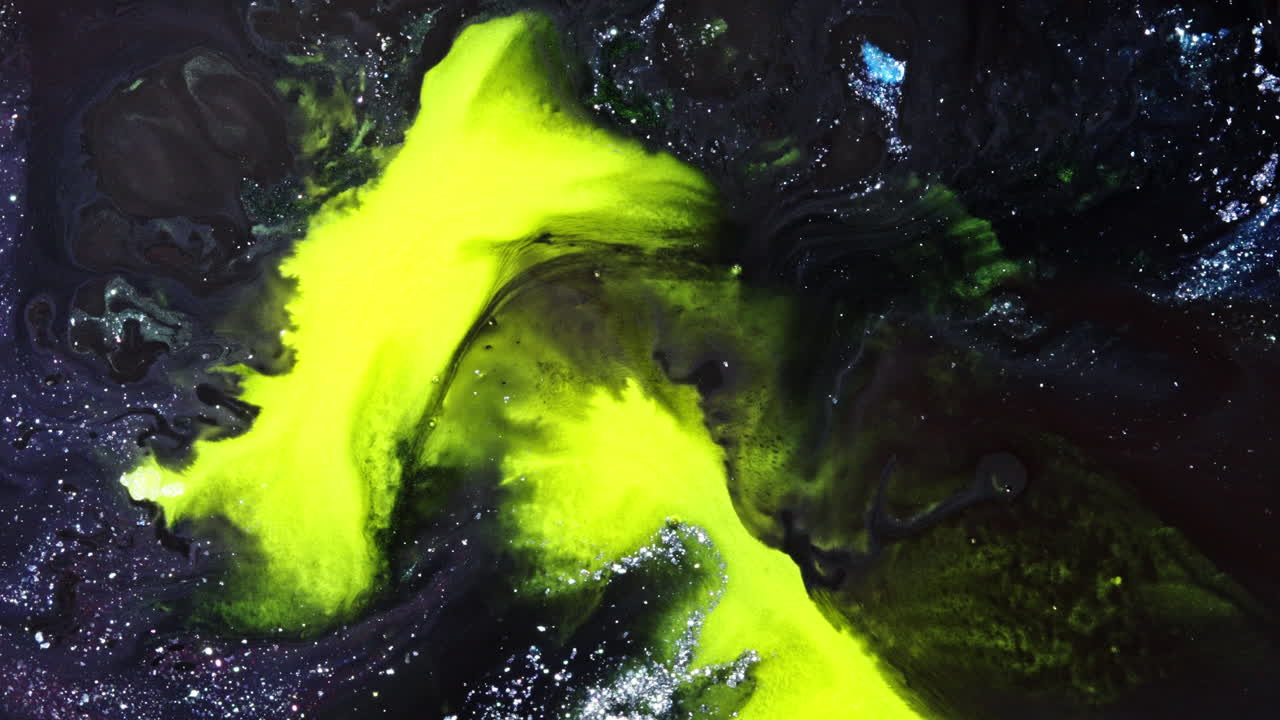 Neon yellow liquid mixing in black fluid, abstract macro shot with cosmic vibes