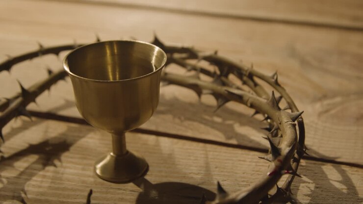 Religious Concept Shot Of Chalice With Crown Of Thorns Placed Around It On Wooden Background 2