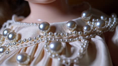 close-up of pearls and satin fabric